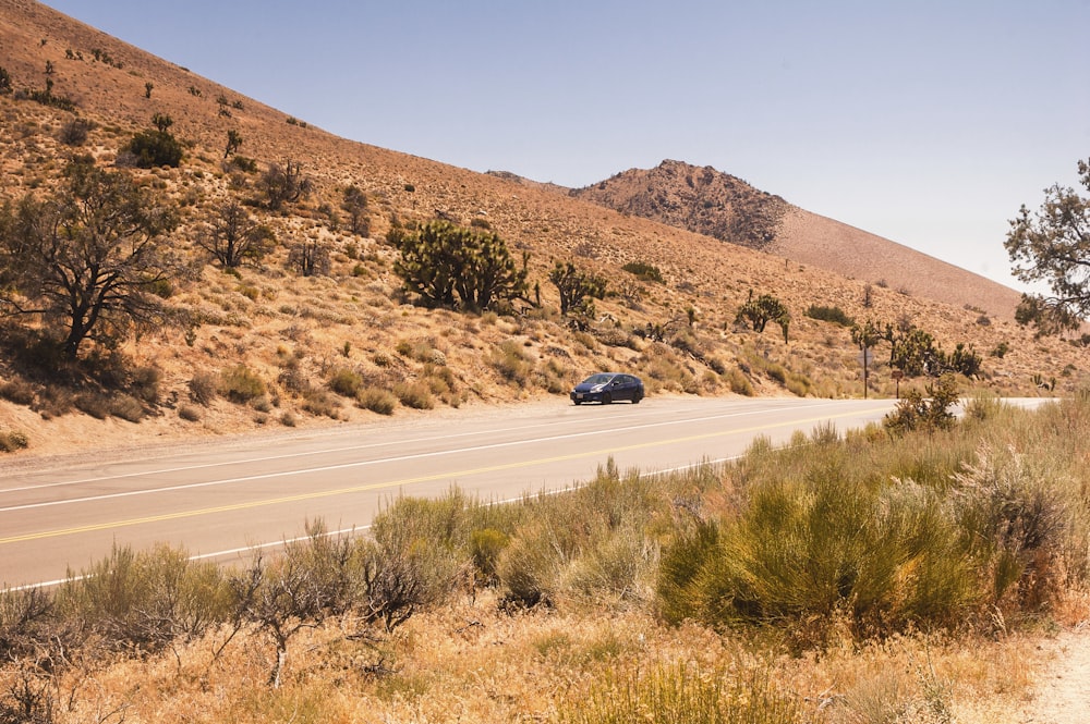 black car on road during daytime