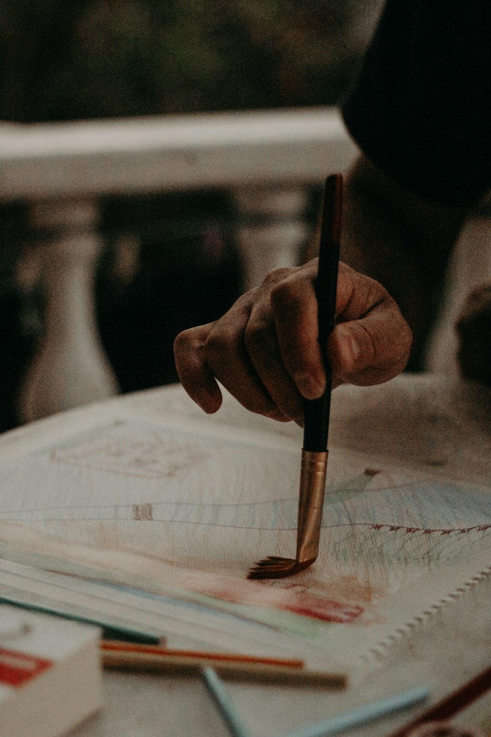 person writing on white paper