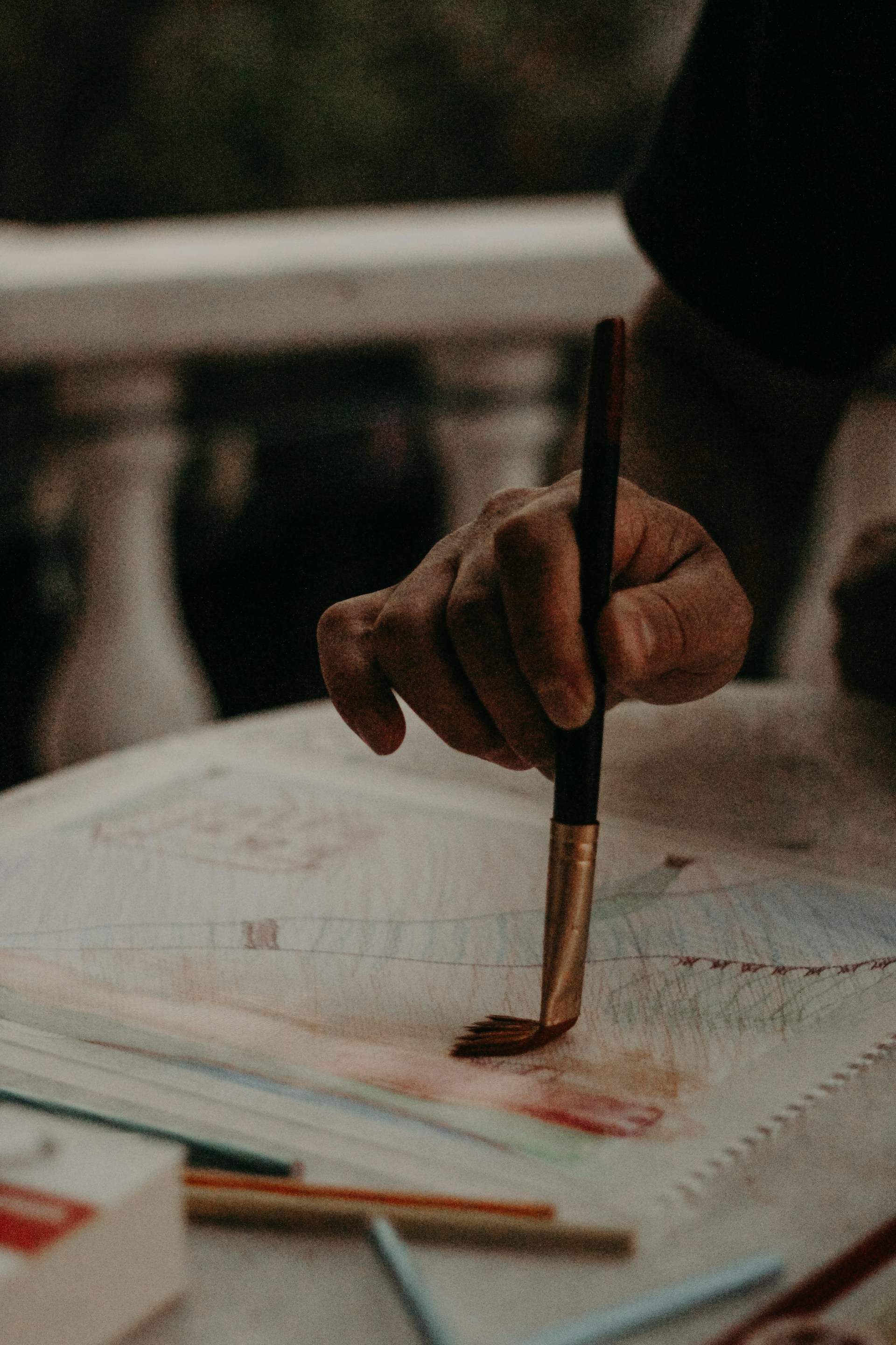person writing on white paper