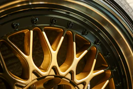 Detailed shot of Kronos Bearings with a metallic black and electric blue finish