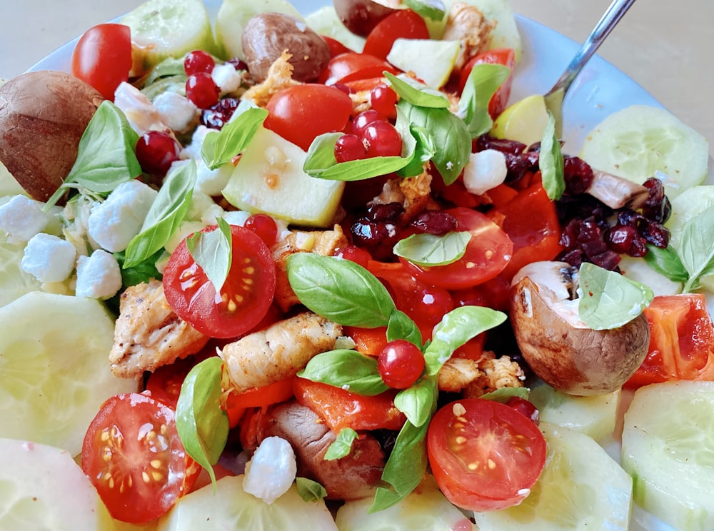 vegetable salad on white ceramic bowl