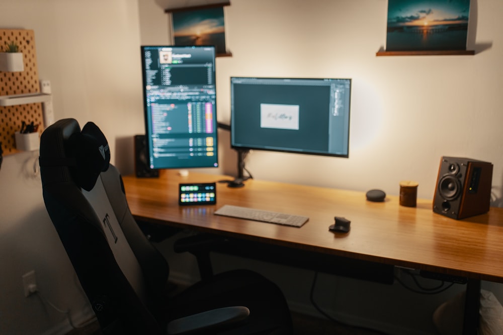 black flat screen computer monitor on brown wooden desk