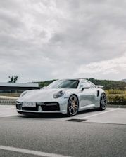 silver mercedes benz coupe on road during daytime