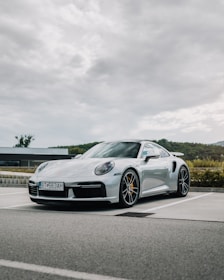 silver mercedes benz coupe on road during daytime
