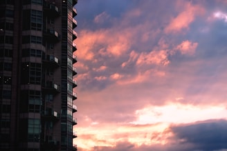 black concrete building under cloudy sky during daytime