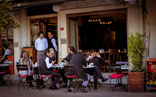 people sitting on chairs in restaurant