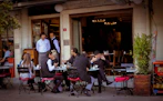 people sitting on chairs in restaurant