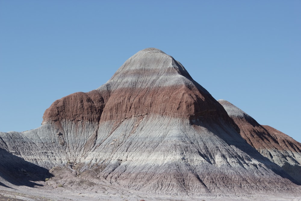 brown rocky mountain under blue sky during daytime