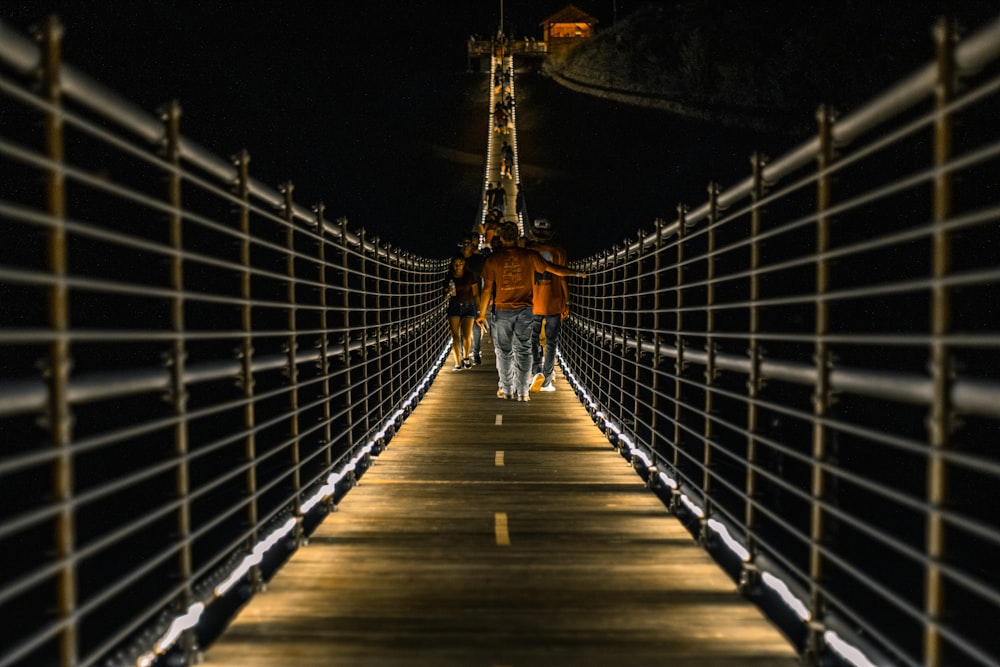 brown wooden bridge during night time
