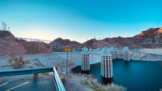 white and brown concrete bridge over river during daytime in Hoover Dam United States