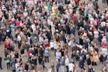 A diverse group of people wearing casual and stylish clothes outdoors.