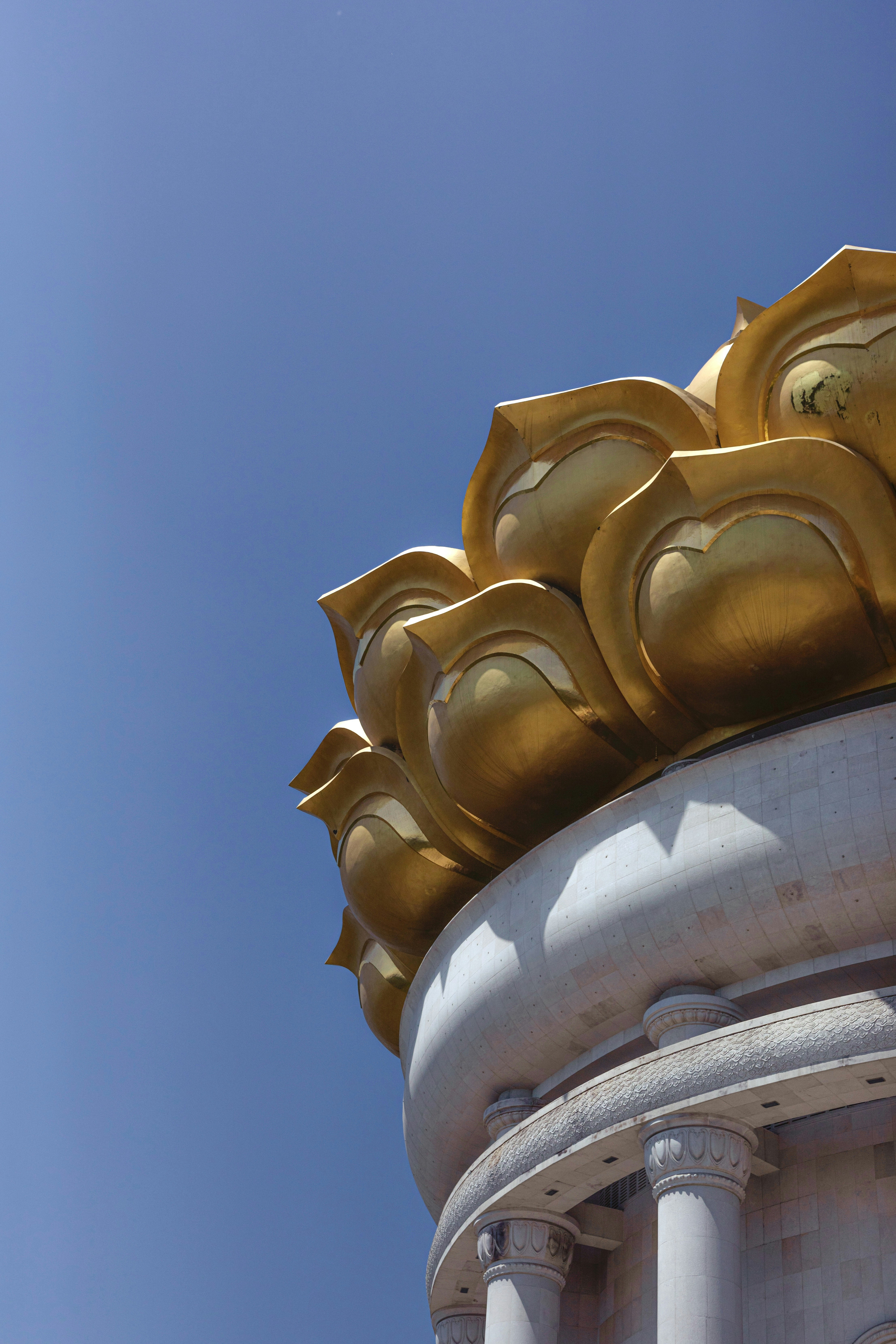 gold dragon statue under blue sky during daytime