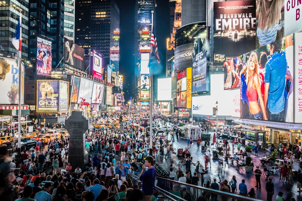 people walking on street during nighttime