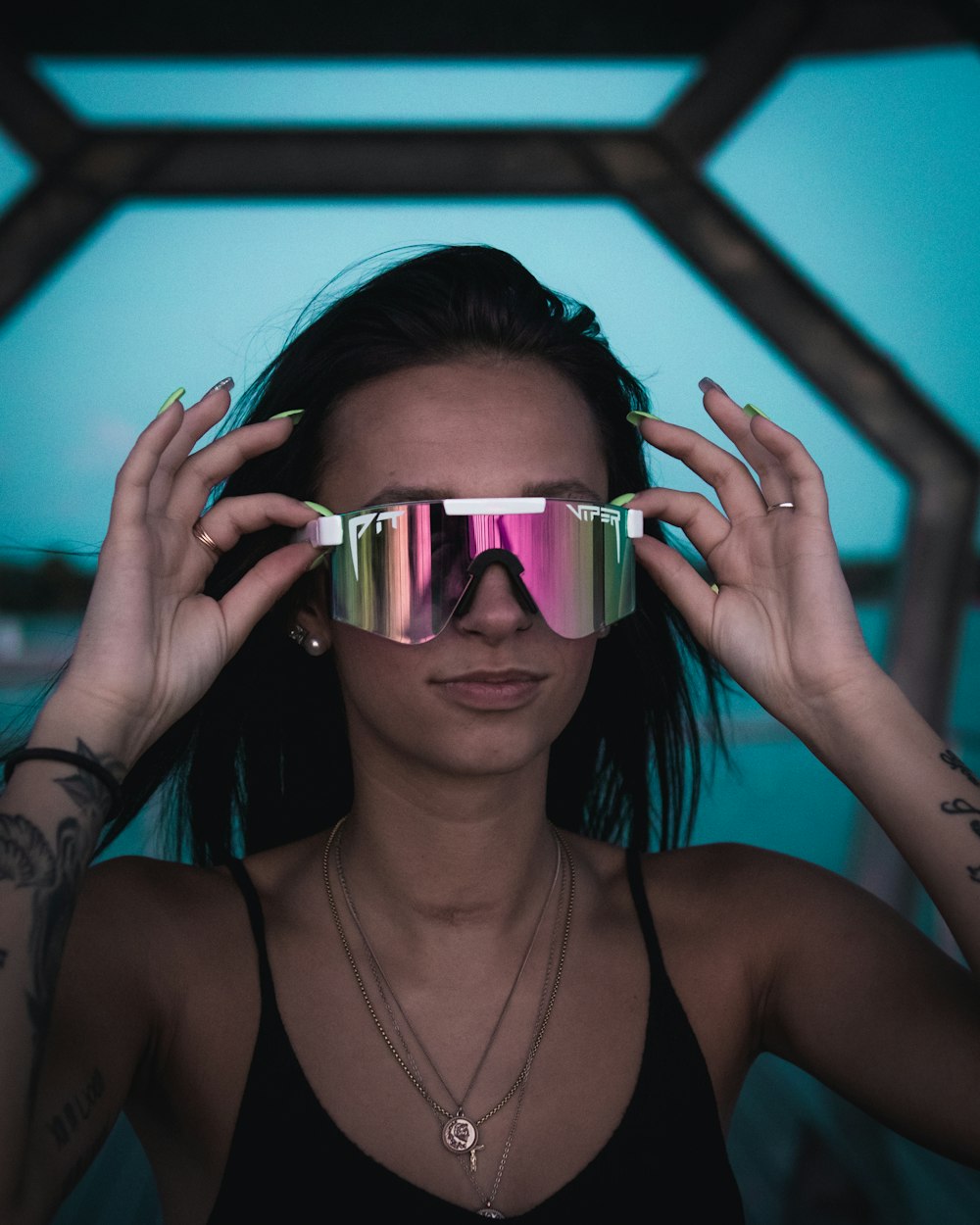 woman in black tank top wearing sunglasses