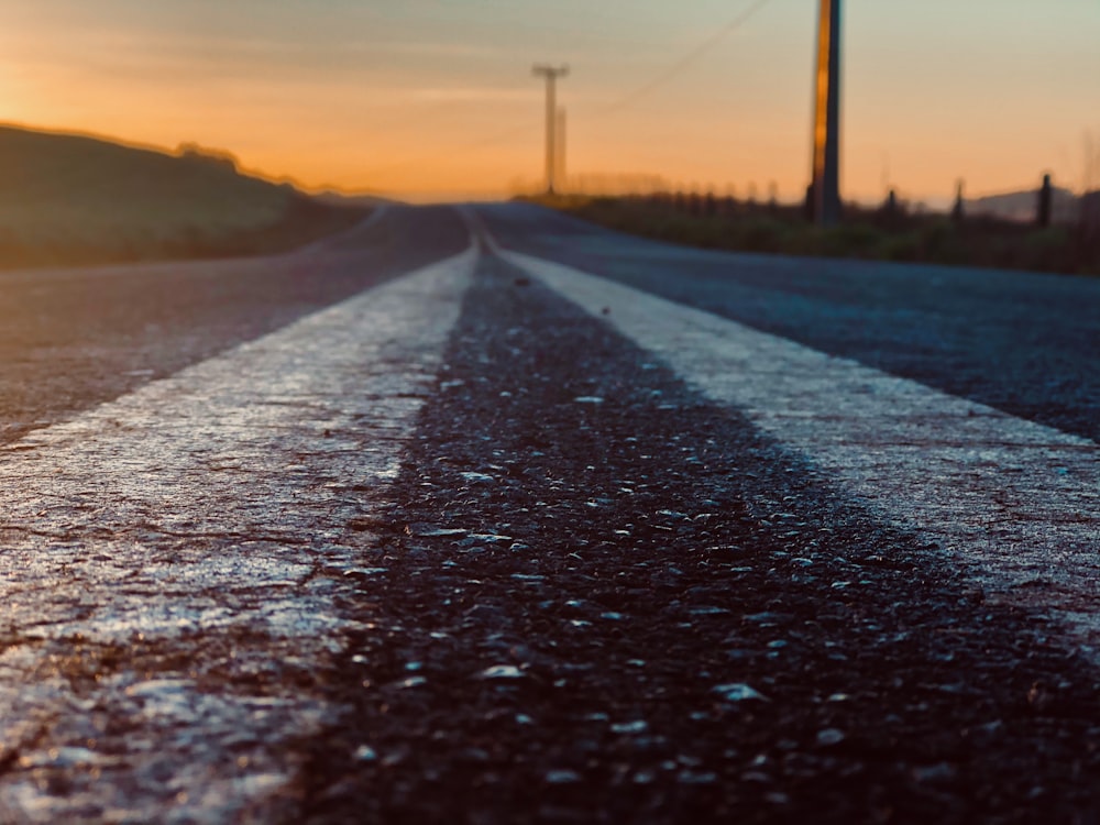 gray concrete road during sunset