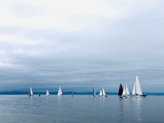 white sail boats on sea under white clouds during daytime in Whidbey Island United States