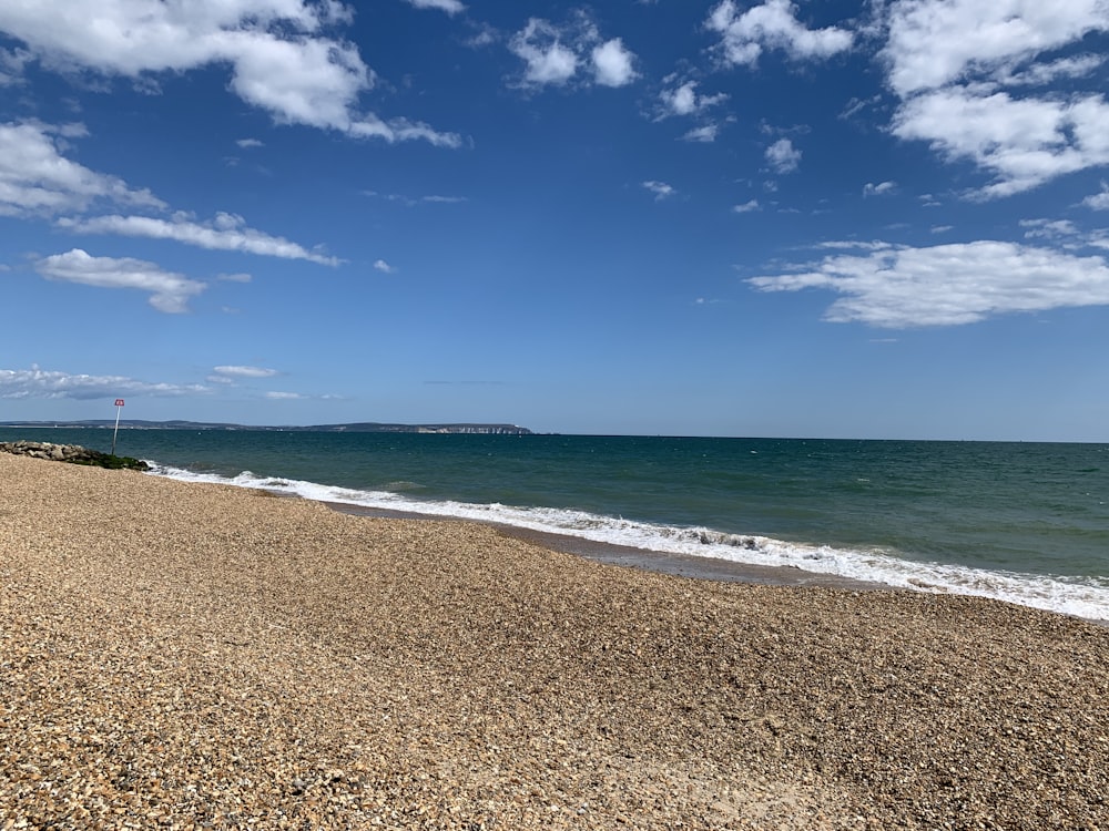 blue sea under blue sky during daytime