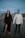 man in white dress shirt standing beside woman in black dress