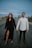 man in white dress shirt standing beside woman in black dress