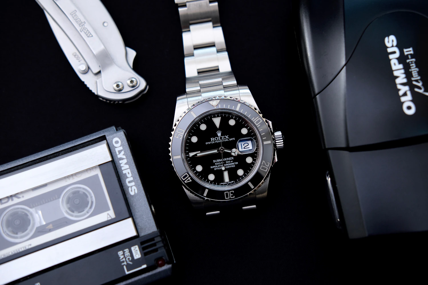 Minimal watch presentation with polished metal and leather details