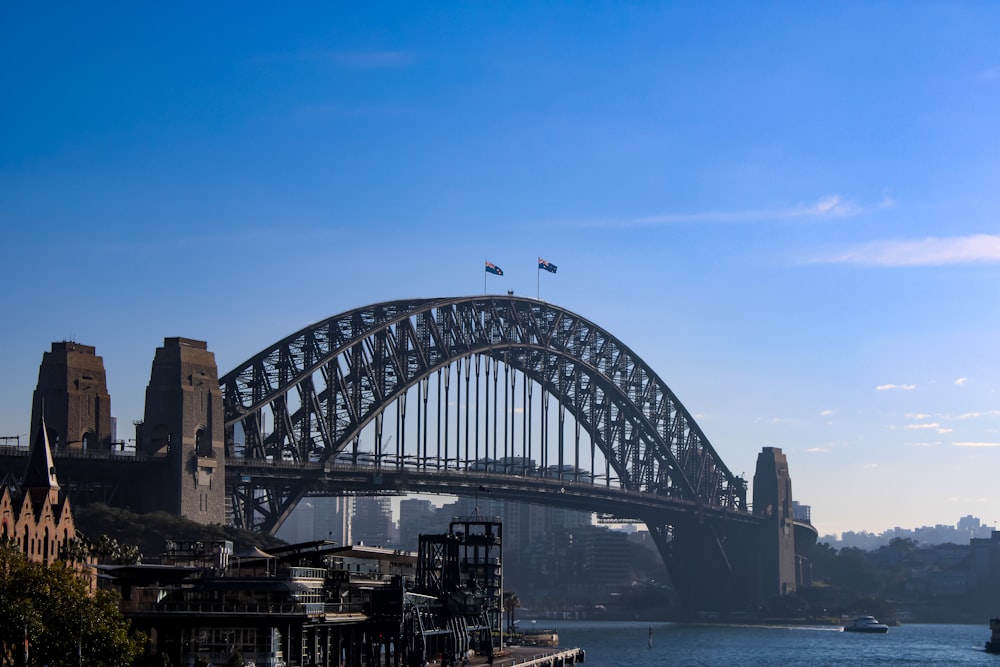 gray bridge over body of water during daytime