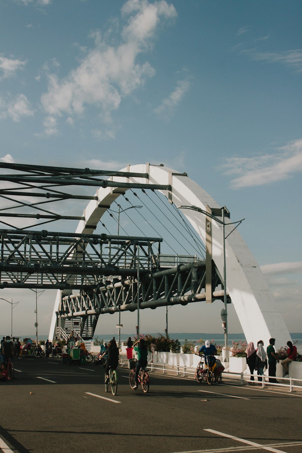 people walking on white bridge during daytime