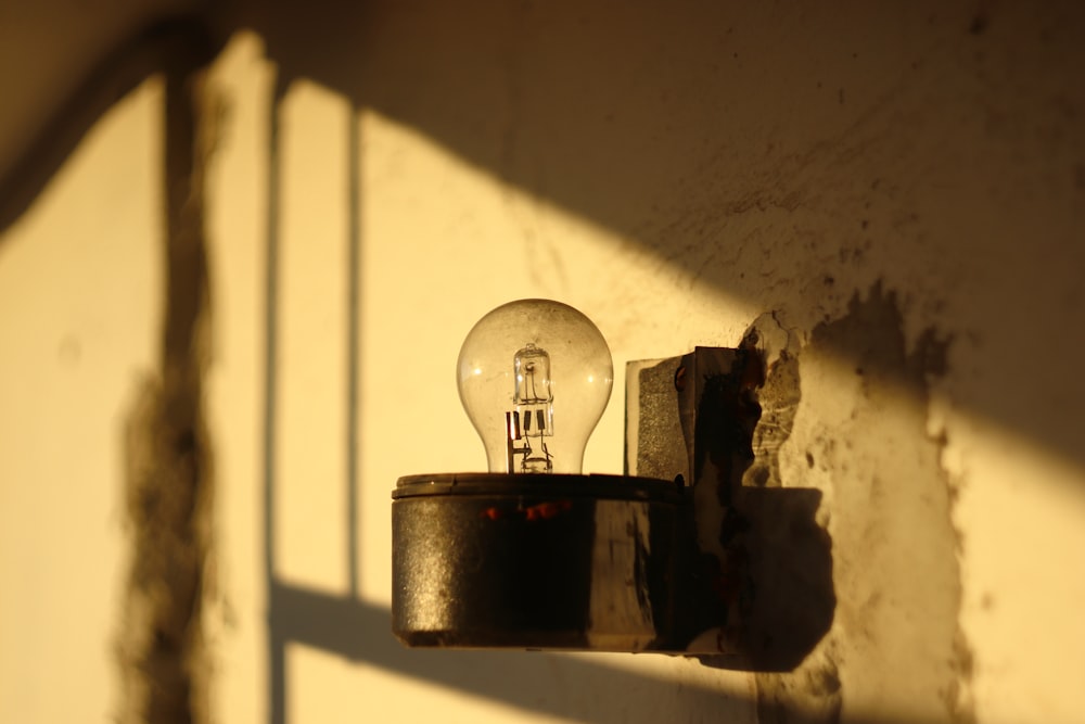 clear glass ball on white wooden shelf