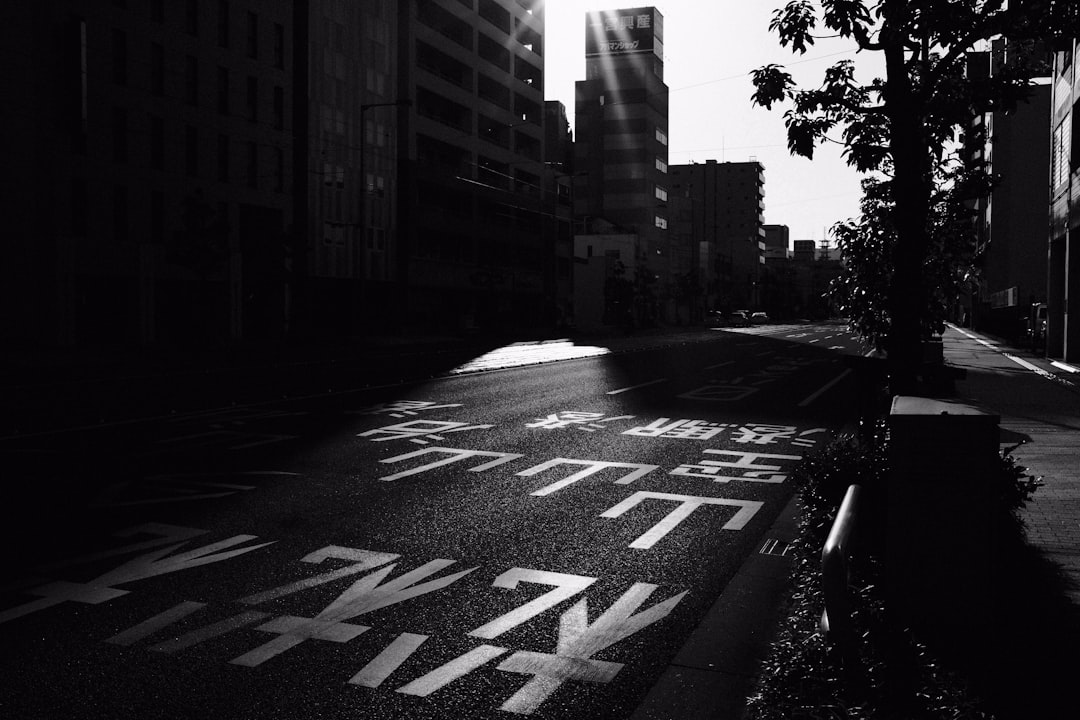 grayscale photo of city buildings