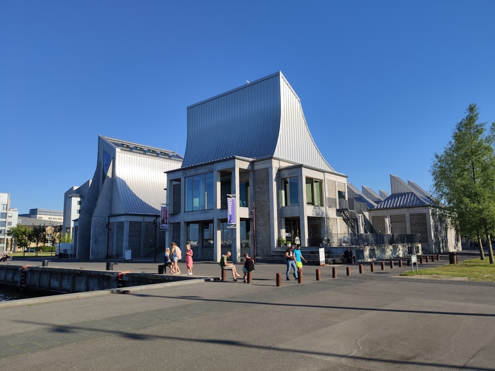 people walking near white building during daytime