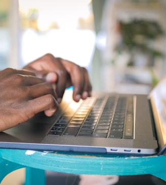 person using silver laptop computer