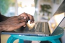 person using silver laptop computer
