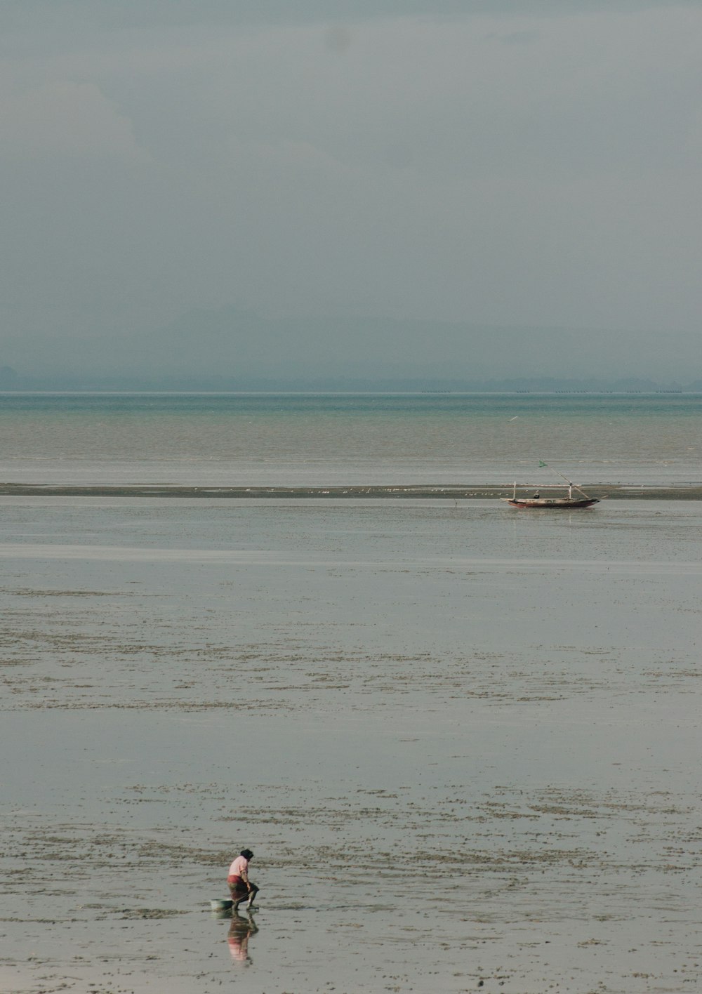 white boat on sea during daytime