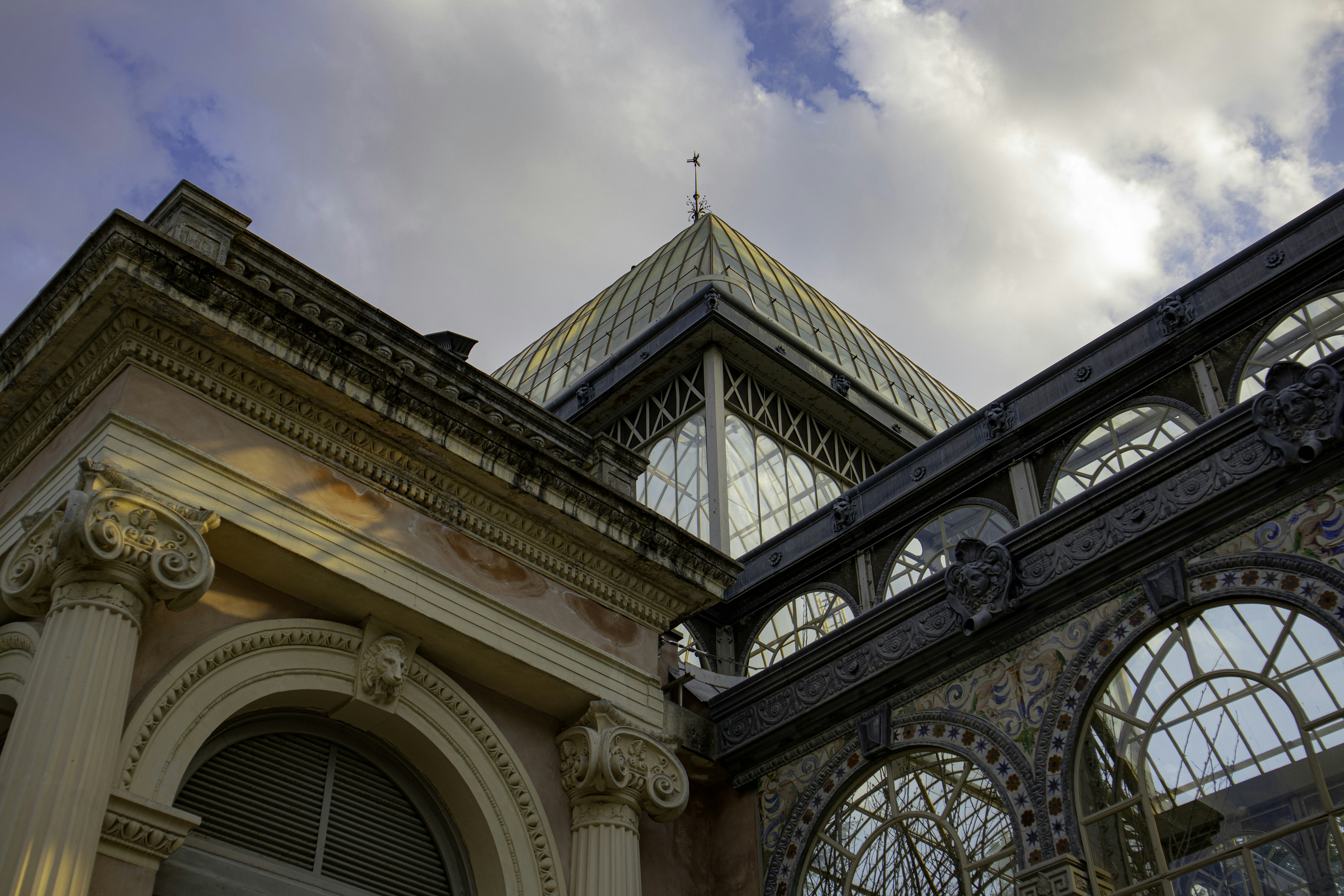 The Palacio de Cristal, located in El Retiro Park in Madrid, Spain on a summer day.