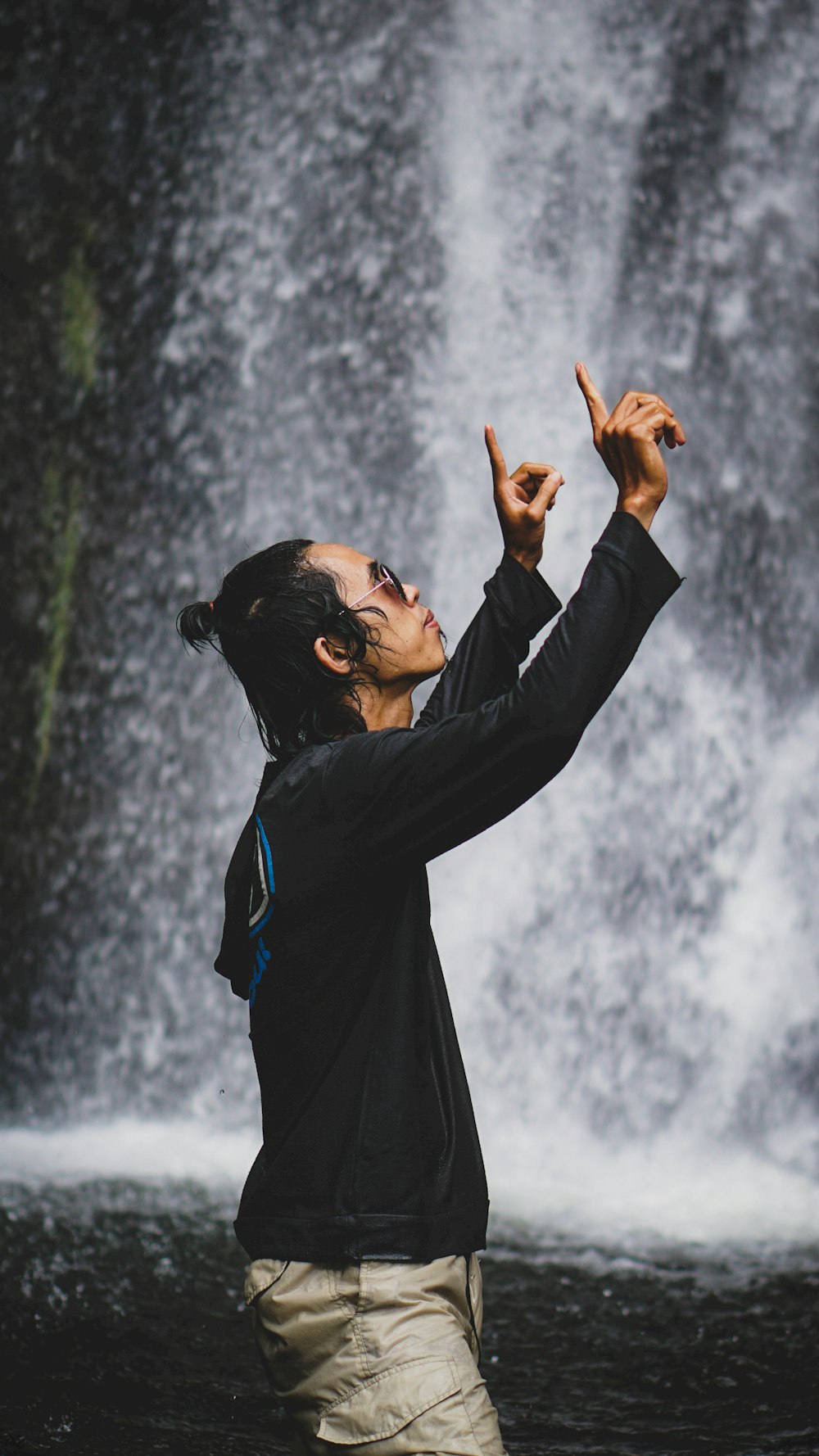 man in black long sleeve shirt holding white powder