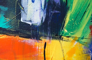 Colorful abstract painting with bold strokes and textured layers on canvas