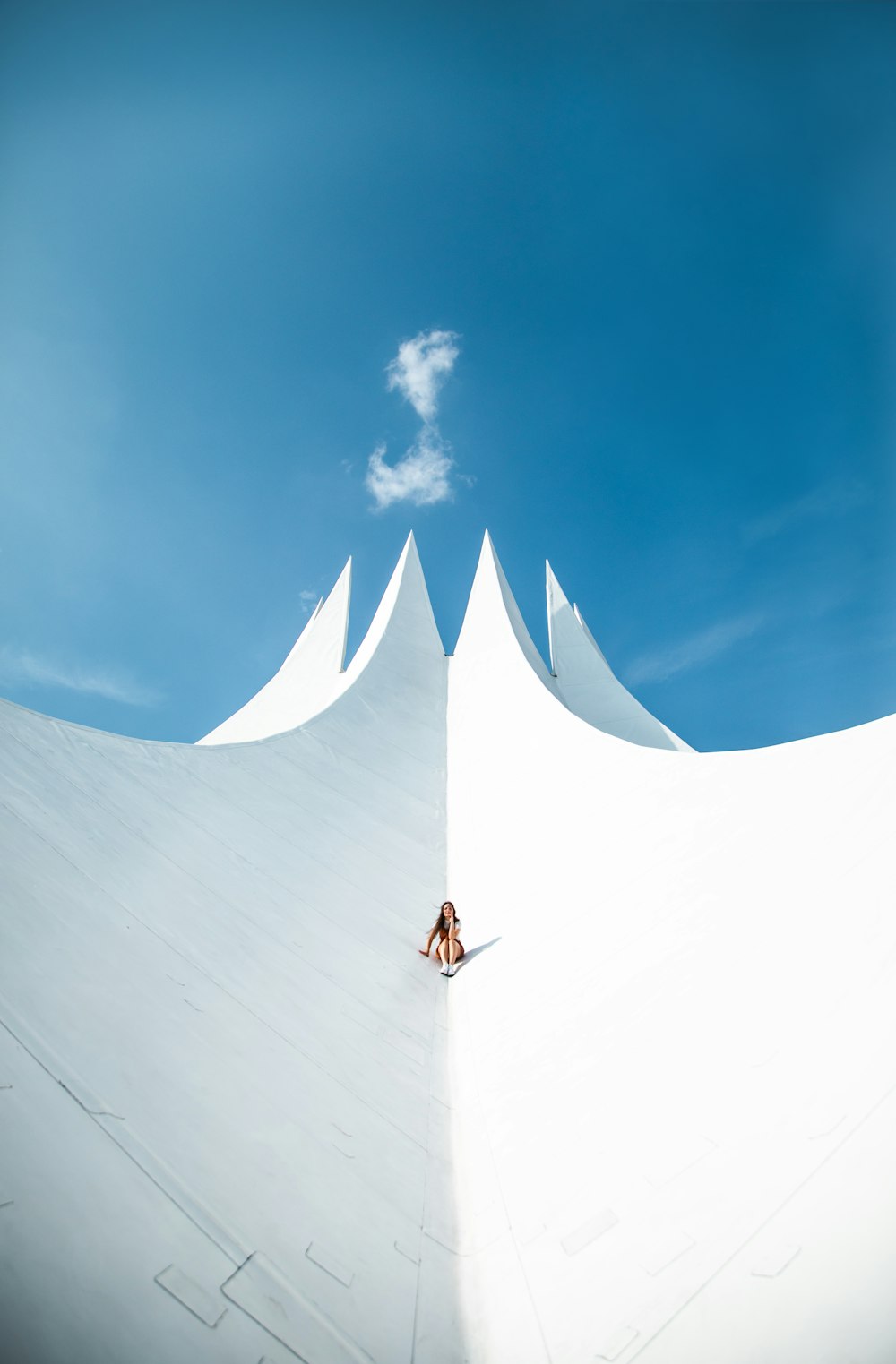 person in black jacket standing on top of building