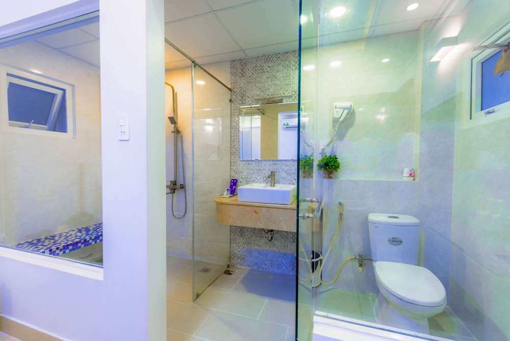 white ceramic sink near mirror