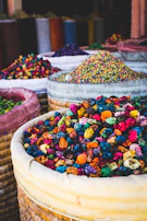Vibrant spices arranged in woven baskets, showcasing the rich colors of Sudanese cuisine.