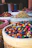 Close-up of vibrant Sudanese spices in traditional woven baskets.