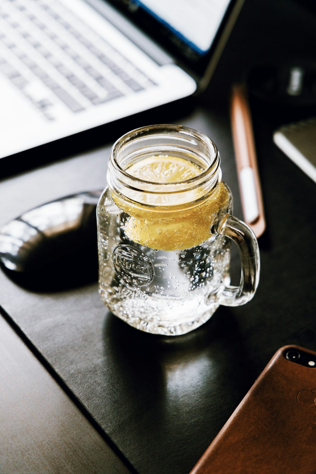 clear glass mug on black table