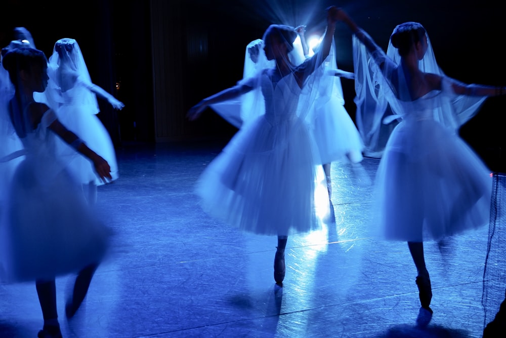 woman in white dress dancing on the floor