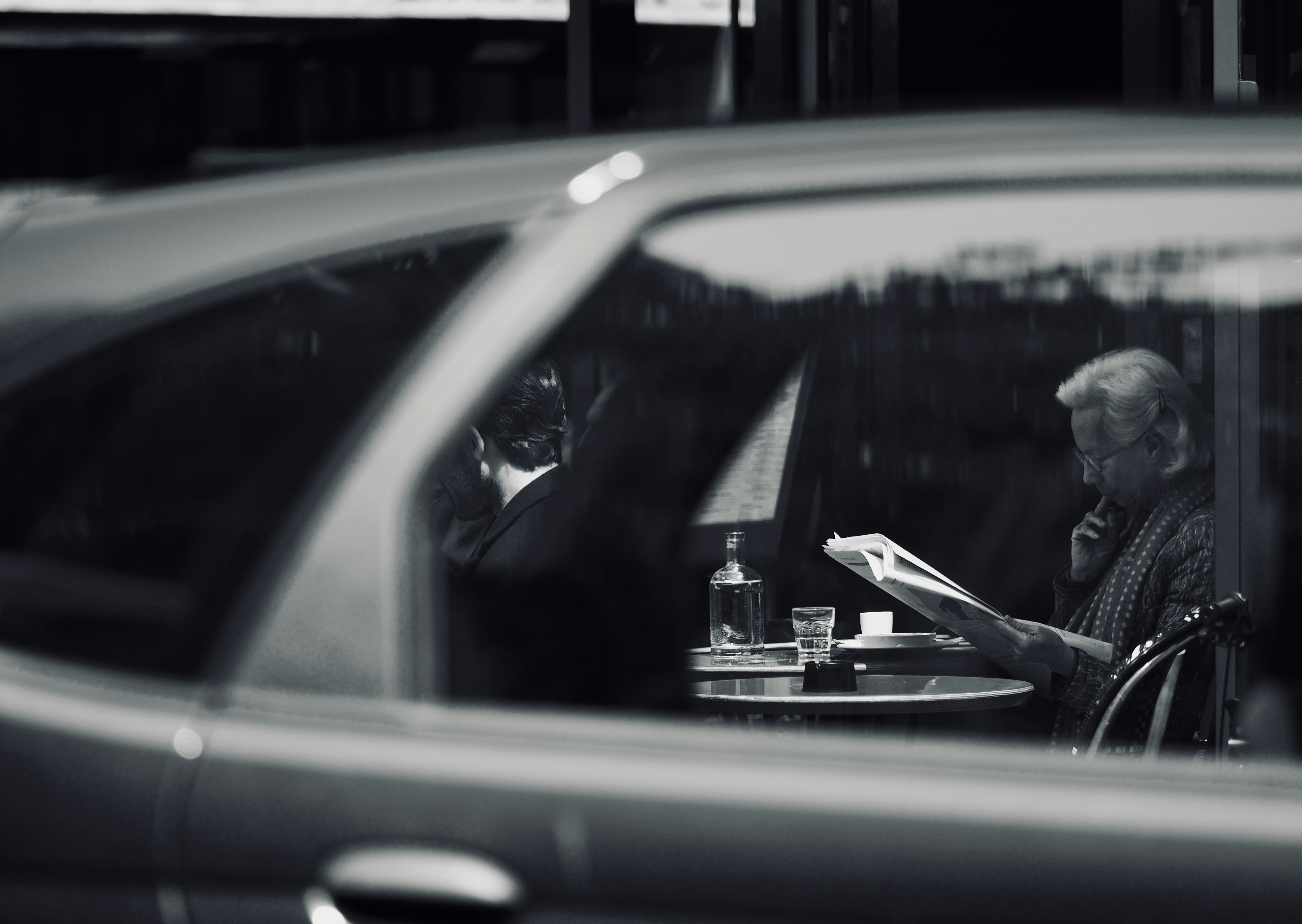 person in black jacket driving car