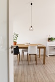white wooden table with chairs