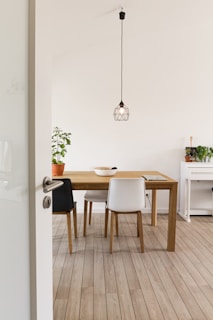 white wooden table with chairs