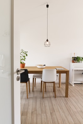 white wooden table with chairs
