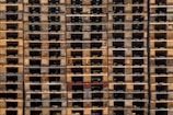 a large stack of wooden pallets stacked on top of each other