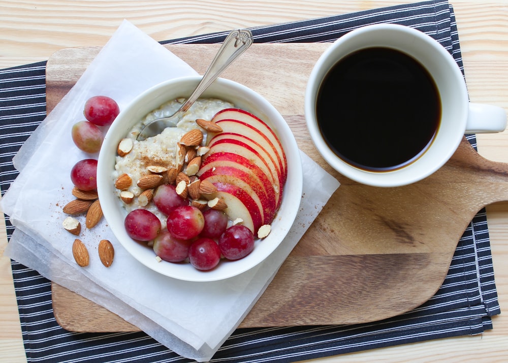 red fruit on white ceramic bowl