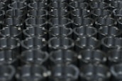 Rows of precision metal parts neatly arranged after CNC machining.