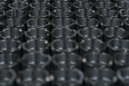 Rows of precision metal parts neatly arranged after CNC machining.
