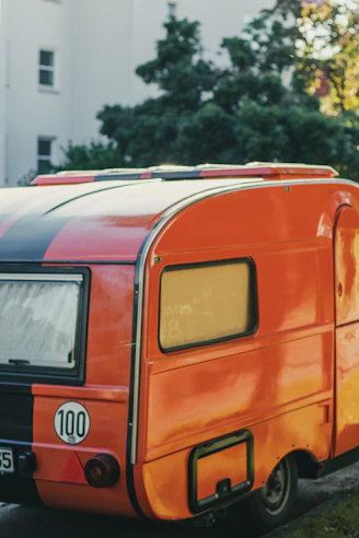 orange and blue van on road during daytime